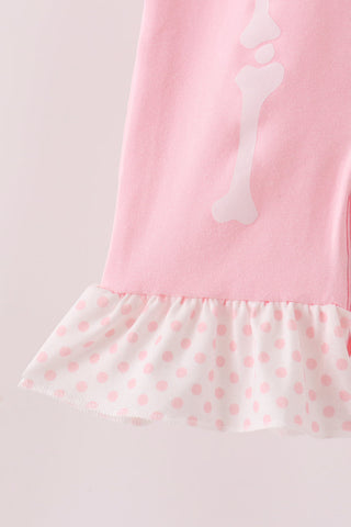 Pink skeleton print ruffle romper