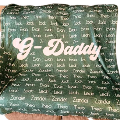 a green and white pillow with the words 9 - daddy printed on it
