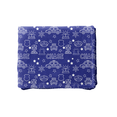 a blue blanket with white stars and cars on it