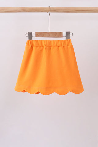 Orange scallop hem bow skort