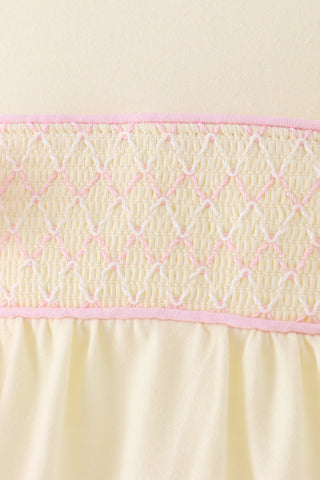 Cream smocked bow bubble