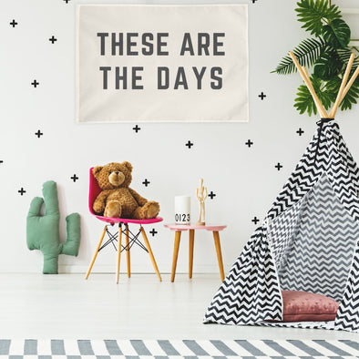 child's bedroom with "these are the days" wall flag hanging up