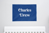 custom name flag in blue that reads "charles drew"